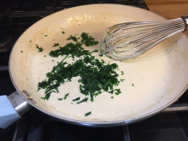 Cream and parsley for Swedish meatballs prior to adding the meat
