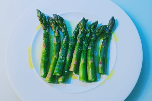 Asparagus ready to be wrapped in Parma ham