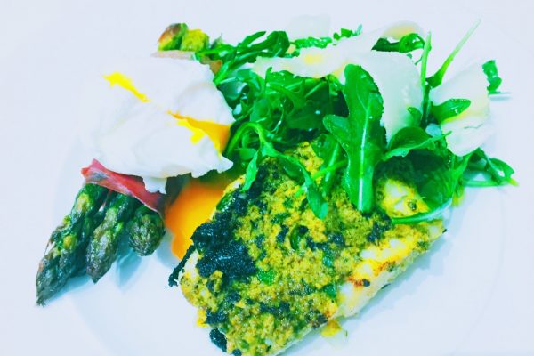 Italian pesto cod with asparagus with Parma ham and poached egg