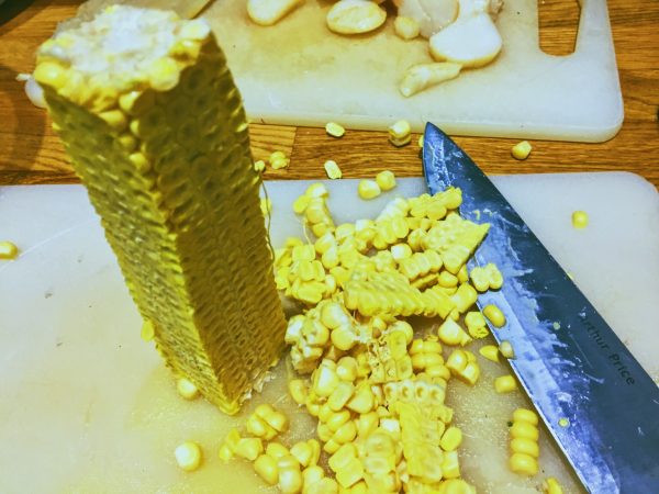 Carefully slice the corn kernels from the corn cob