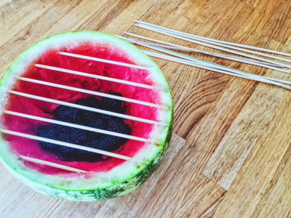 Fruit BBQ from a watermelon with charcoal from blackberries