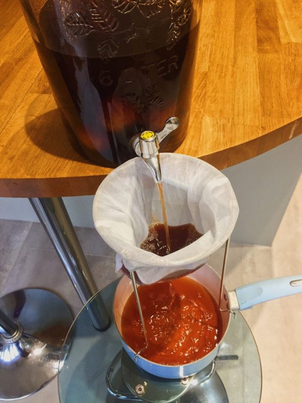 When the Plum Gin is ready you need to strain it to remove the sediment