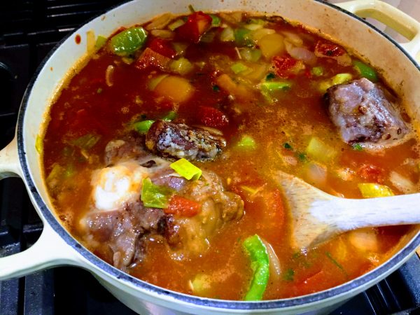 Your Oxtail should be nicely covered and bathed in cooking broth which will reduce Oxtail Stew Africa